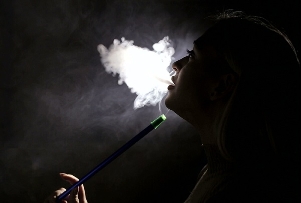 Girl smokes hookah